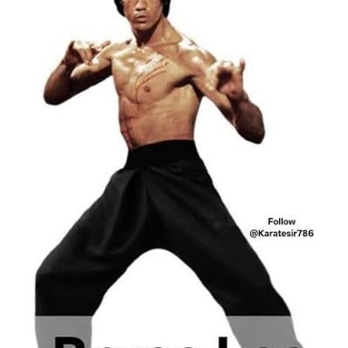 Bruce Lee demonstrating a martial arts pose.