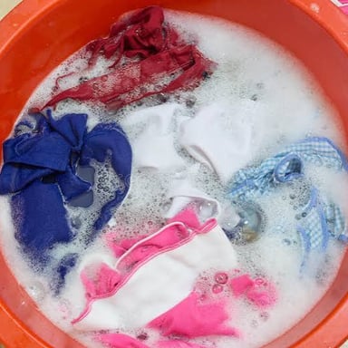 A piece of cloth soaking in a container of water