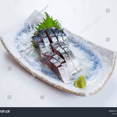 Thin slices of sashimi served with wasabi and shredded daikon