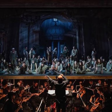 An opera singer performing with an orchestra.