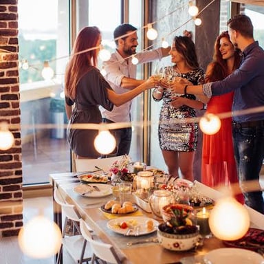 People celebrating in a newly furnished home.
