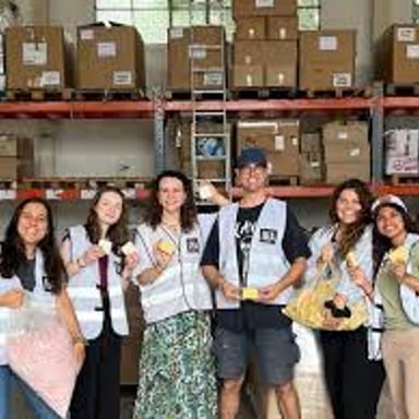 Aid workers distributing supplies as an example of the work some nongovernmental organizations do.