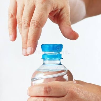 Hands turning a threaded bottle cap to open the bottle.