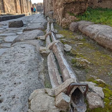 An ancient Roman lead water pipe, an example of the metal’s use in Roman infrastructure.
