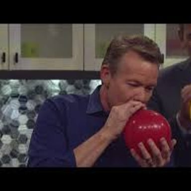 A person speaking after inhaling helium from a balloon