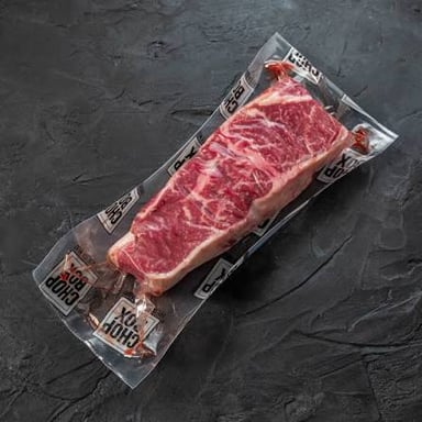 A steak labeled as an end cut on a butcher’s counter.