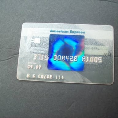 An American Express payment card showing the company’s familiar blue branding.