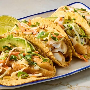 Fish tacos topped with shredded coleslaw