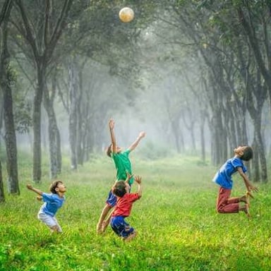 A young child playing, representing the informal word tyke.