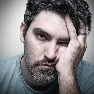 A frustrated person reacting exasperatedly