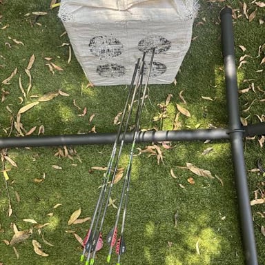 An arrow has landed beside, rather than in, the target.