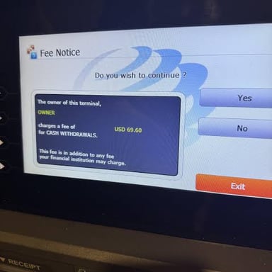 An ATM displaying a transaction fee notice