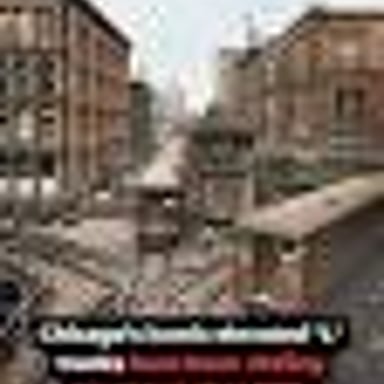 A Chicago elevated train traveling on tracks above a city street.