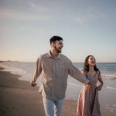 A newlywed couple enjoying a beach honeymoon getaway.
