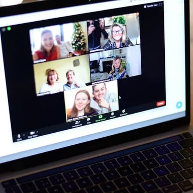 A video call in which one participant is speaking and the others indicate they cannot hear.
