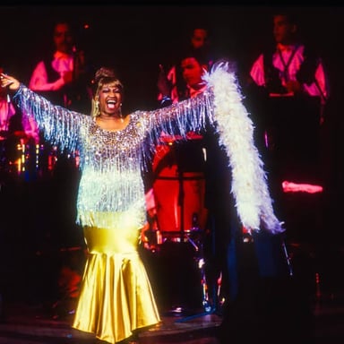 Celia Cruz performing on stage.