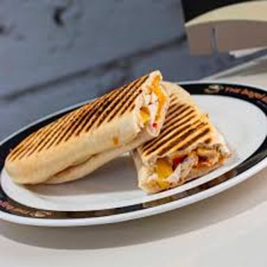 A pressed sandwich with toasted grill marks.