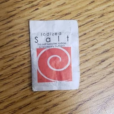 Table salt labeled as iodized, indicating that iodine has been added.