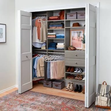 A compact closet fitted with shelves to make the most of its storage space.