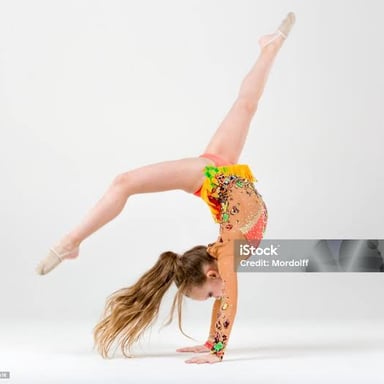 A gymnast performing a somersault on a padded floor