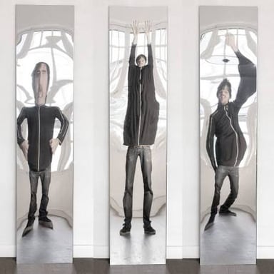 A reflection visibly warped by a funhouse mirror.