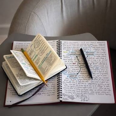 A person writing information into a notebook