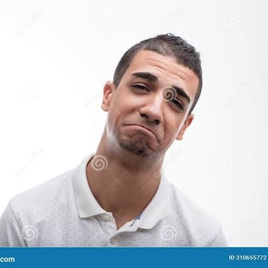 A person wearing a regretful expression.