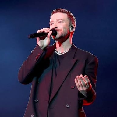 Singer Justin Timberlake performing onstage.