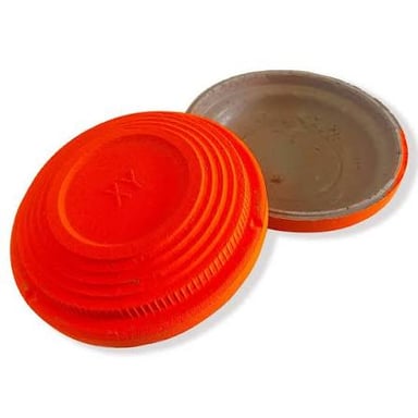 A disc-shaped clay target used in shooting practice.