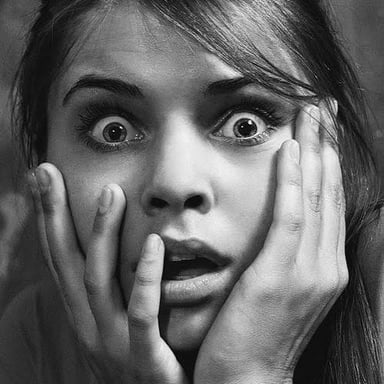 A person reacting with astonishment.