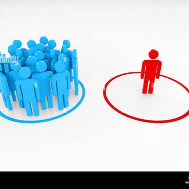 A person standing apart from a group, appearing detached.