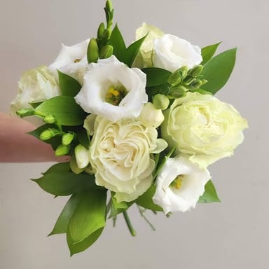 A small hand-tied bouquet of flowers