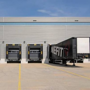 Commercial loading dock beside a cargo truck