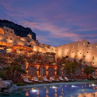 The exterior of a small, stylish hotel.