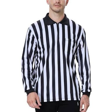 A soccer referee wearing a black-and-white striped shirt signals on the field.