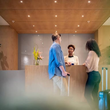 People mingling in conversation at a reception