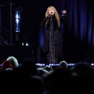 Stevie Nicks performing as a singer on stage.