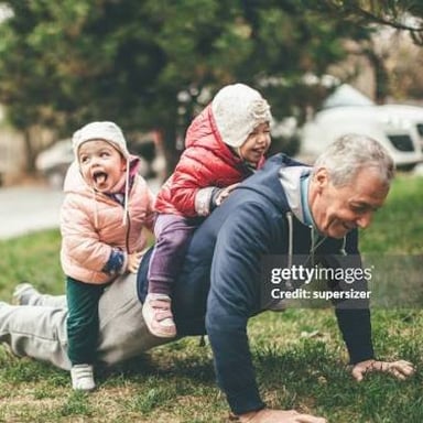 A grandfather spending time with his daughter and grandchild.