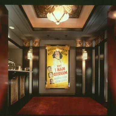 An interior lobby at the entrance to a theater.