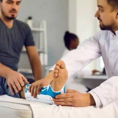 A foot-care specialist examining a patient's foot.
