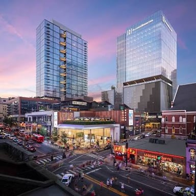 A city’s downtown business district, with streets and tall buildings.