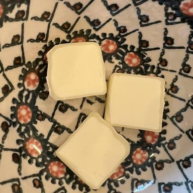 Butter shown in a dish as an example of spoiled food.
