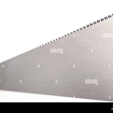 A close-up of the teeth along a hand saw blade.