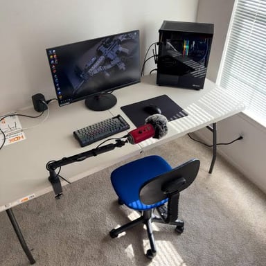 A temporary office worker seated at a desk.
