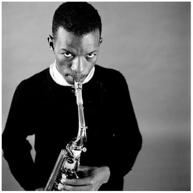 Ornette Coleman playing a saxophone.