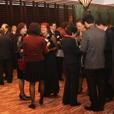 People talking together at a social gathering.
