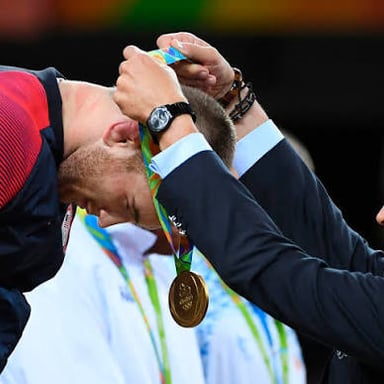 An athlete being awarded a medal after a competition.