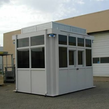 A military guardhouse building with barred windows.