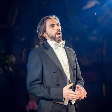 A male opera singer performing a tenor role