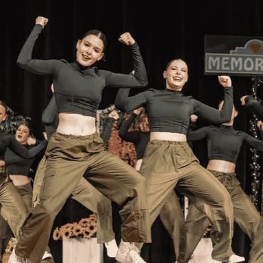 A dancer moves energetically during a performance.